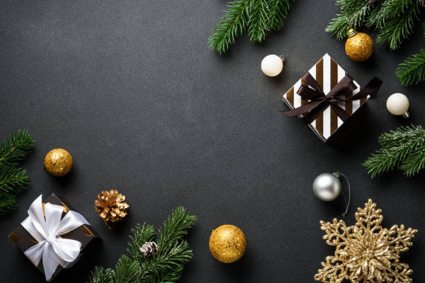 istock Black christmas background. Christmas flat lay with spruce tree and decorations. 2188061199