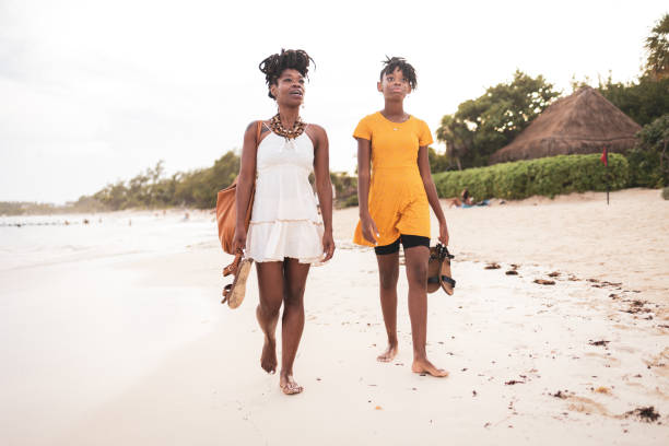 istock Mother and daughter enjoying a walk on a Mexican beach 2188061547