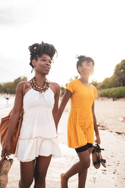 istock Mother and daughter exploring a sunlit beach during their vacation in Mexico 2188061556