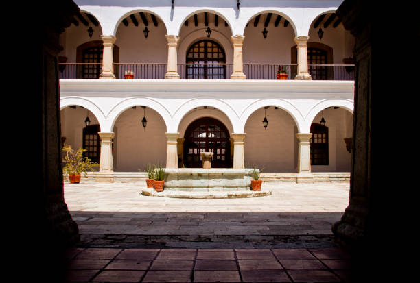 istock Mexican patio with a classical stone fountain and iron forge balcony. 2188063928