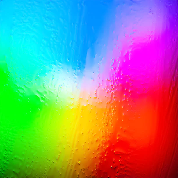 istock Abstract background. Abstract blur image of multicolored rainbow gradients and glare through frozen glass. The texture of water and ice drops on a frozen ice glass 2188072653