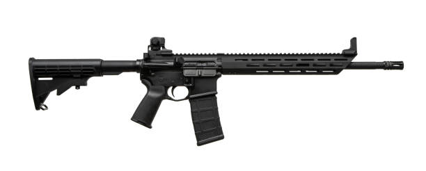 istock Modern AR-style rifle with a lightweight modular design, black matte finish, adjustable stock, Picatinny rail, ergonomic grip, and M-LOK handguard. Perfect for tactical or sport shooting. 2188074342