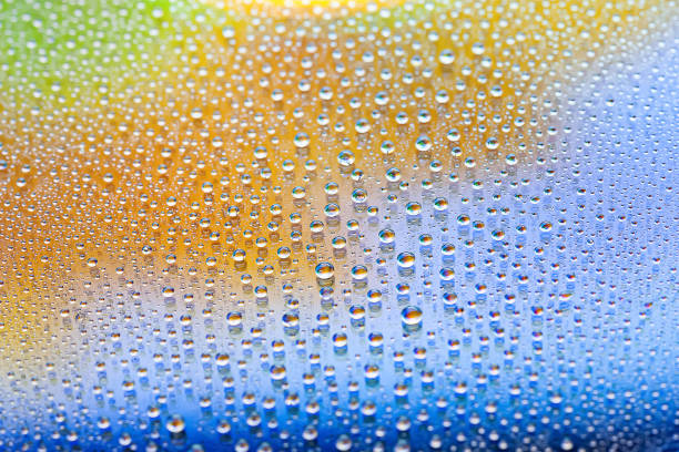 Water drops. Abstract gradient backdrop The texture of the drops. Multicolored gradient. Heavily textured image. Shallow depth of field. Selective soft focus