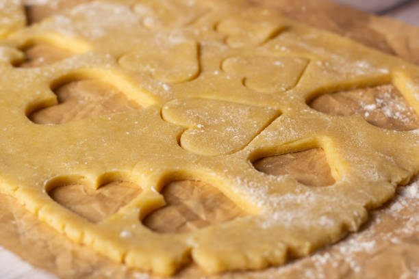 istock Heart-shaped cookie dough ready for baking in a cozy kitchen 2188079662