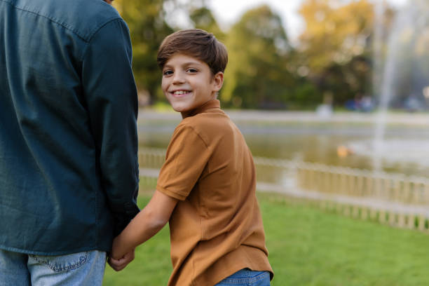 istock Cherishing Moments: Father and Son Together Outside 2188082392