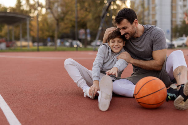 istock Playful Moments: Father and Son Enjoying Basketball Together 2188082430