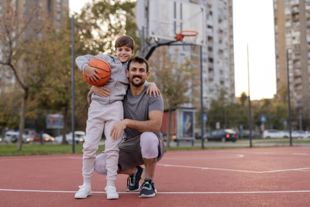 istock Playful Moments: Father and Son Enjoying Basketball Together 2188083016