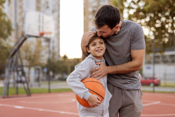 istock Basketball Bonding: Dad and Son Together on the Court 2188083065