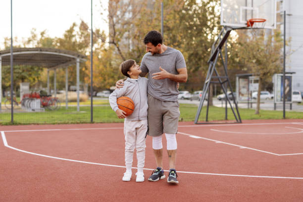 istock Basketball Talk: Dad and Son Sharing Tips on the Court 2188083086