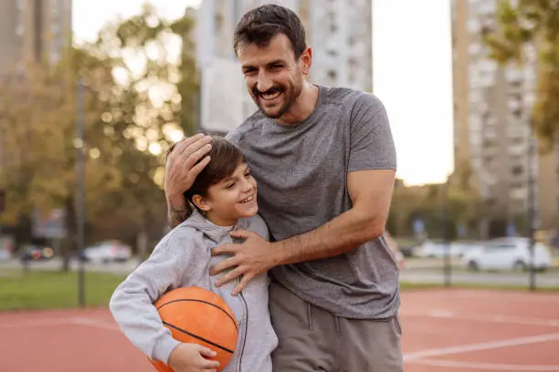 Basketball Bonding: Dad and Son Together on the Court Basketball Bonding: Dad and Son Together on the Court