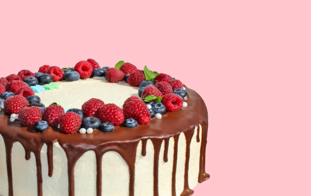 istock Easy Birthday Drip Cake with chocolate ganache and sprinkles on a white background with party decor. Horizontal. Copy space. 2188085705