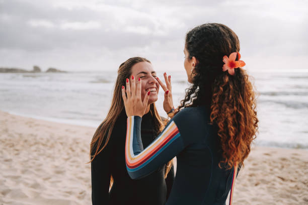 Friend putting sunscreen on her face
