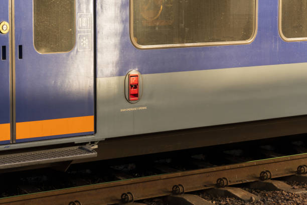 istock A blue and gray electric train is stationed on the railway platform, highlighting its modern industrial design and functionality. The train stands still, waiting for passengers at noon 2188093346