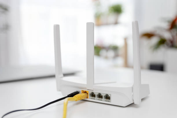 istock Modern wi-fi router on light table in room 2188095660