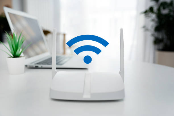 istock Modern wi-fi router on light table in room 2188095676