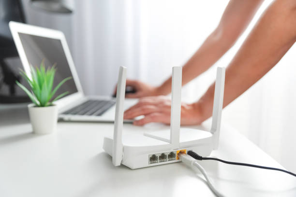 istock Modern wi-fi router on light table in room 2188095697