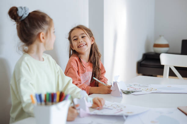 istock Sisters having fun with paints at home 2188097520
