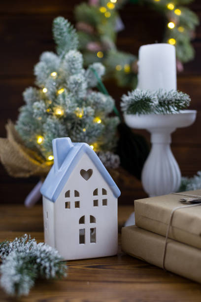 istock Christmas lights on fir branches, side. Holiday gifts under the tree 2188097828