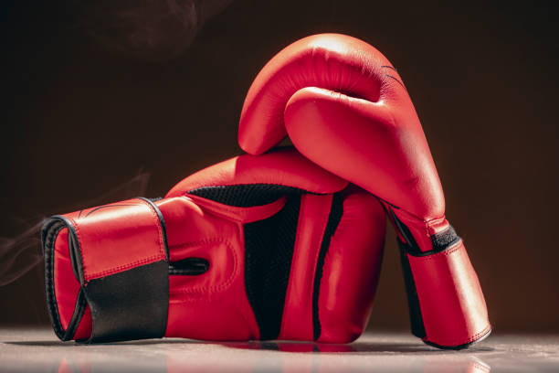 istock A pair of red boxing gloves on dark background. 2188098134