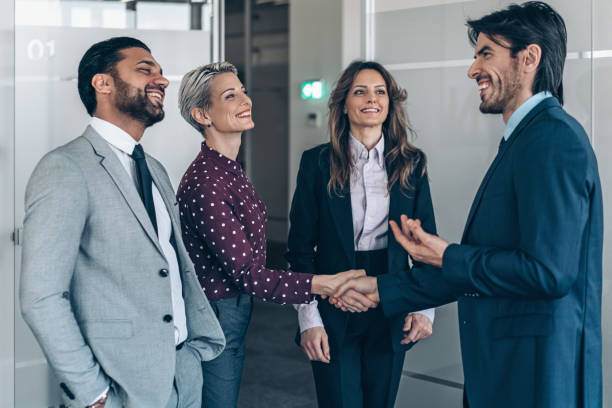 istock Two business person shaking hands 2188100472