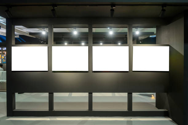 istock blank billboards and blank canvas paintings with spot lights isolated on white inside the exhibition area 2188103191