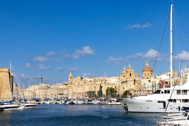 A picturesque view of Birgu, one of Malta’s historic Three Cities, renowned for its impressive fort, vibrant marina, and scenic waterfront.