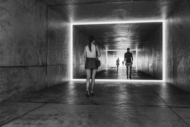 istock People walking in empty futuristic concrete corridor 2188106266