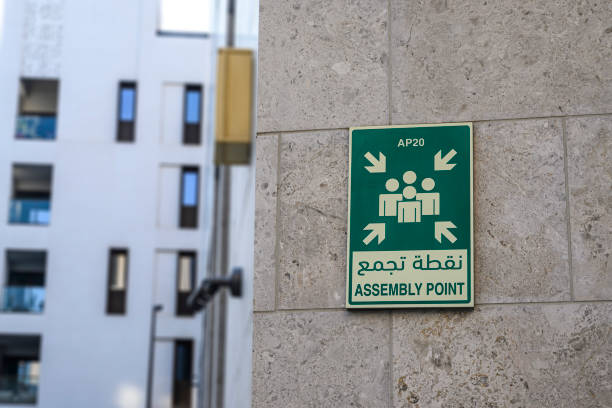 istock assembly point sign on the building wall 2188107719