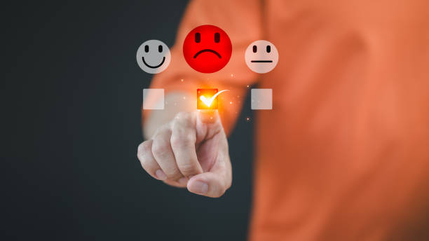 istock Engaging in an online customer feedback survey, a male user touching to display an angry emoticon on a virtual screen, sharing their opinion and reviewing service satisfaction. 2188115463