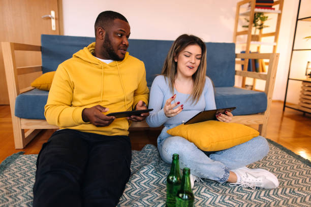 istock Friends playing games on a tablet 2188123996
