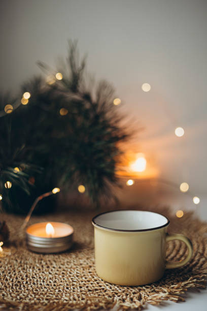 istock Christmas cozy home background with candle and cup on windowsill, copy space. 2188126244