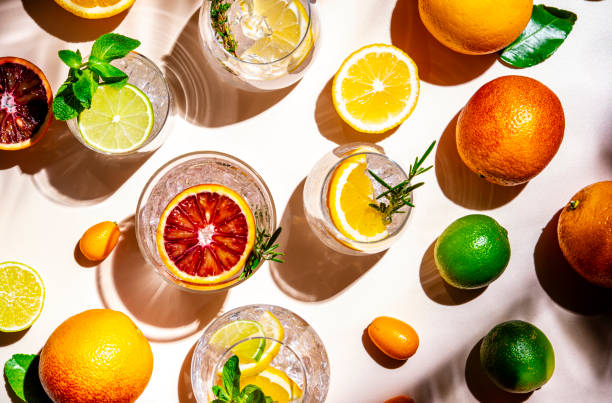 istock Gin and citrus cocktails, top view. Beige background, hard light, shadow pattern, top view 2188126313