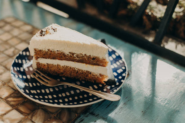 istock Delicious cake on a plate in a cafe. Daylight. Close up. 2188126348