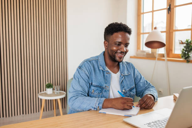 istock Man Engrossed in Online Class at Home 2188127679