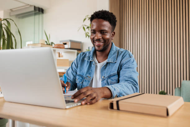 istock Man Engrossed in Online Class at Home 2188127727