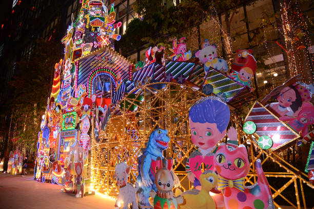 Bangkok , Thailand - December , 2024 : Beautiful cartoon characters and light bulbs decorations at Christmas tree in Celebration 2025 at Emsphere Shopping Mall during Christmas and New Year's Day for Christmas day and Happy New Year event on December 3 , 2024 in Bangkok capital city.