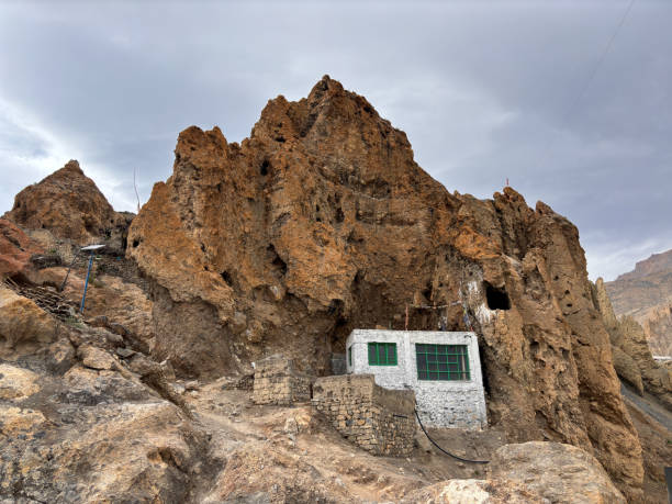 istock A small house is built into a large rock, Spiti Valley India 2188132215