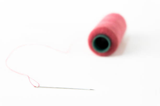 Close up of thread spindles of different color used in stitching clothes