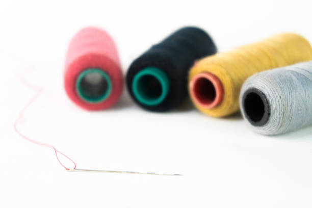 Colored sewing thread spools, used for the household clothing industry. isolated on white background.