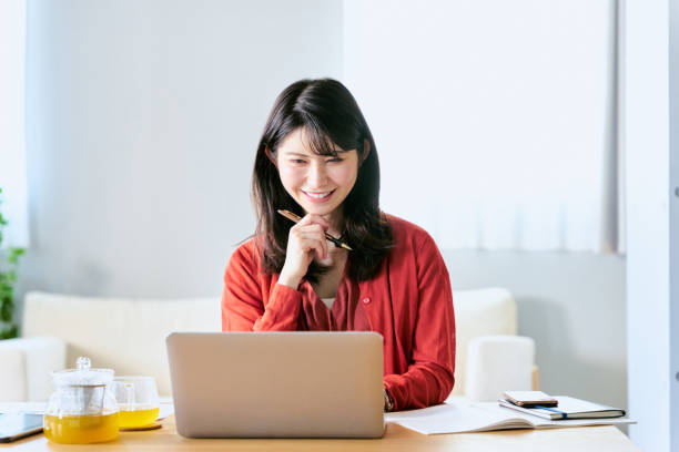 istock A college student studying using a laptop in the living room at home 2188134052