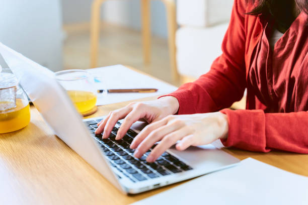 istock A woman who inputs a table in the room table at a bright time on a holiday on a table with a drink 2188134327
