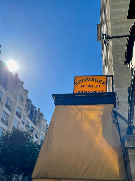 istock Charming Parisian cheese shop sign under a vibrant blue sky 2188141301