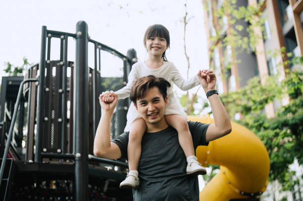 istock Asian father carrying his daughter at public park 2188142785