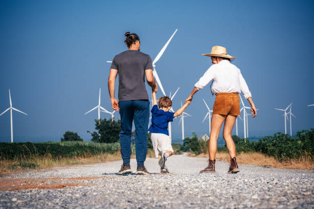 istock Parents and son walk together holding hands 2188142998