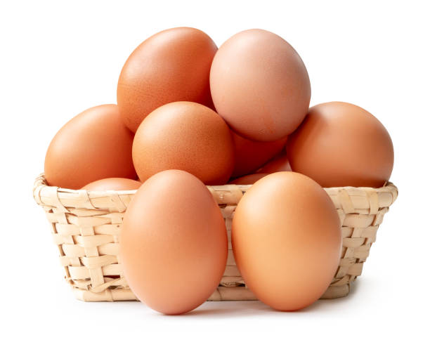 istock Group of fresh brown chicken eggs in stack in wicker basket isolated on white background with clipping path 2188145816
