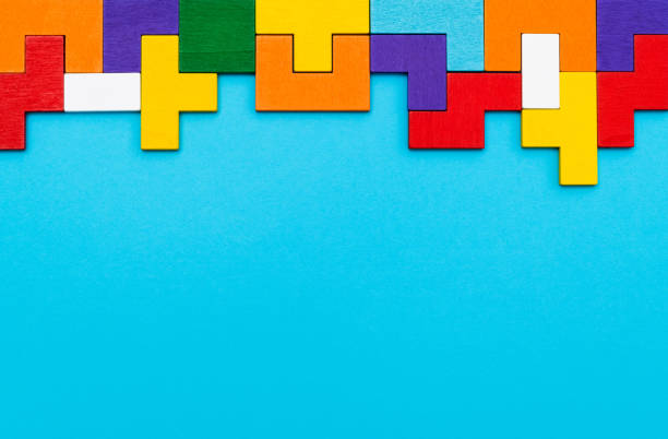 istock Different colorful shapes wooden blocks on blue background 2188151149