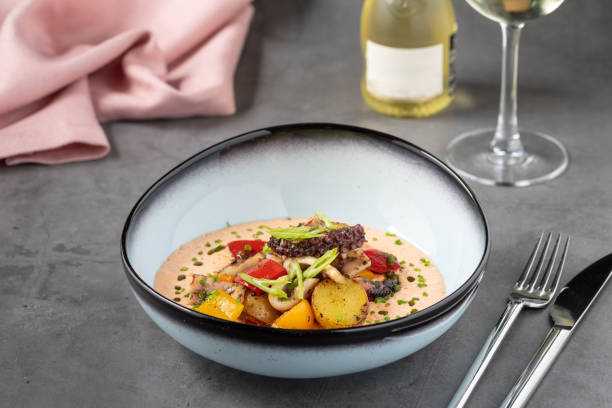 istock Grilled octopus with creamy sauce, potatoes and vegetables 2188151222