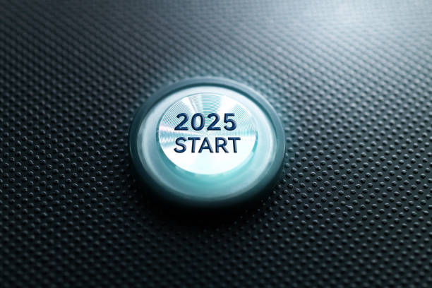 Blue illuminated start button of new year 2025
