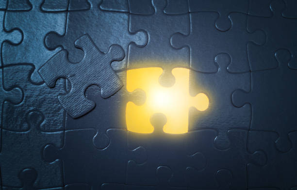 Top view of many puzzle pieces throughout the frame. Background image of scattered colorful puzzle pieces. Mind games