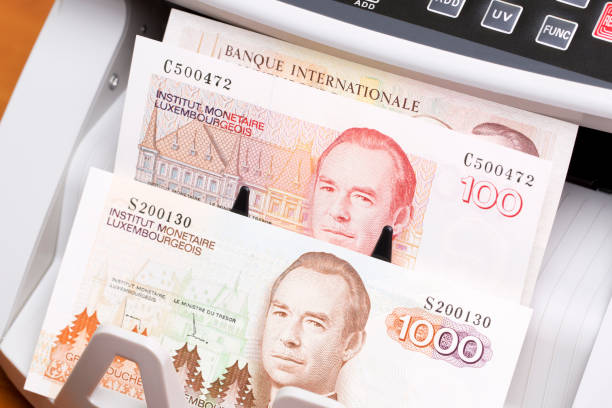 istock Luxembourg franc in the counting machine 2188153034